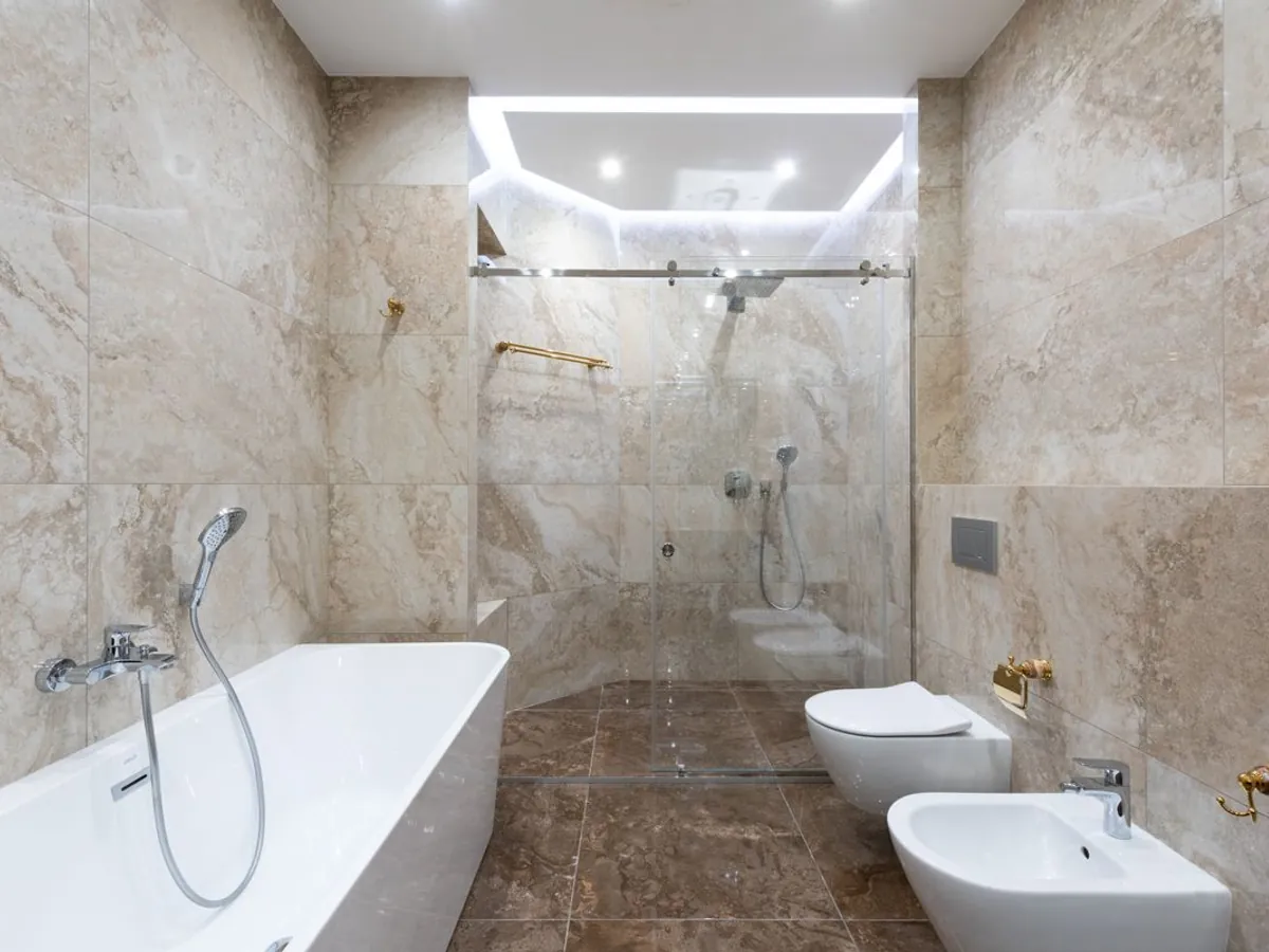 Master bathroom with rain shower at Embassy Riverine